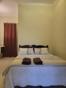 Postel nebo postele na pokoji v ubytování NusaTuah Roomstay
