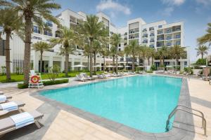 an image of a swimming pool at a resort at Palace Beach Resort Fujairah in Fujairah