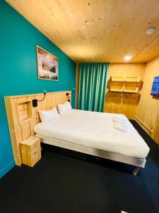 a bedroom with a bed and a desk at The People - Les 2 Alpes in Les Deux Alpes