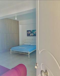 A bed or beds in a room at House Marina