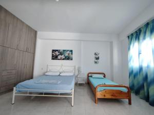 A bed or beds in a room at House Marina
