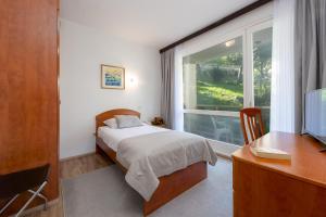 Cama o camas de una habitación en Hotel Vis