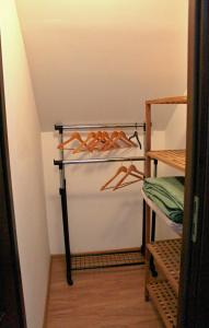 a closet with a rack of hangers at Private holiday house Vivendi in Liptovský Mikuláš