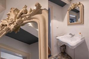 a bathroom with a mirror and a sink at Sterlogies City Penthouse in Leeuwarden