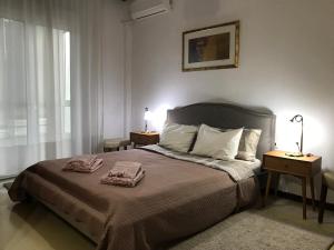 Posteľ alebo postele v izbe v ubytovaní Cosy Seaside Apartment