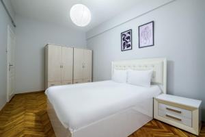 Кровать или кровати в номере Fully Equipped Cozy Home in Kadikoy
