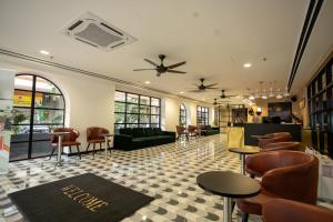 a restaurant with chairs and tables in a room at Citrus Hotel Johor Bahru by Compass Hospitality in Johor Bahru