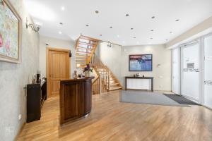 an empty living room with a staircase and a stair case at Senoji Palanga in Palanga