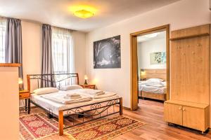 Posteľ alebo postele v izbe v ubytovaní Central Apartments