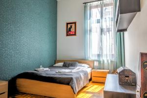 Posteľ alebo postele v izbe v ubytovaní Central Apartments