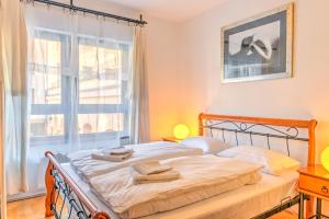 Posteľ alebo postele v izbe v ubytovaní Central Apartments