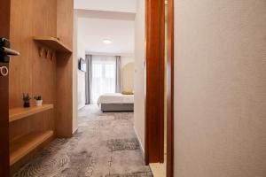 Postel nebo postele na pokoji v ubytování Hotel Nova