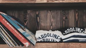 a wooden shelf with books on a table at Bardoliners in Bardolino