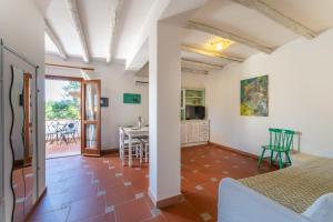 a room with a view of the kitchen and living room at Villa Antonina in Porto Rotondo