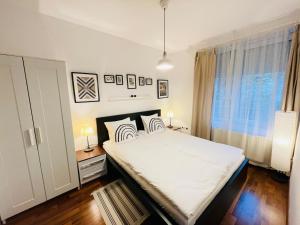 Posteľ alebo postele v izbe v ubytovaní Peony Székely Mihály Apartment - Free Garage