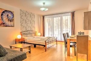 Posteľ alebo postele v izbe v ubytovaní Central Apartments
