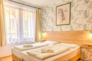 Posteľ alebo postele v izbe v ubytovaní Central Apartments