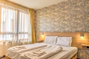 Posteľ alebo postele v izbe v ubytovaní Central Apartments