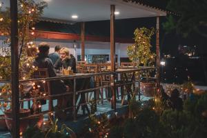 a group of people sitting at a bar at night at Nepalaya Hotel in Kathmandu
