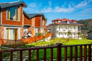 a row of houses with a yard at Zanike hotel in Trabzon