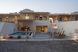 a house with a swimming pool in the desert at Symphony Residence in Vóthon