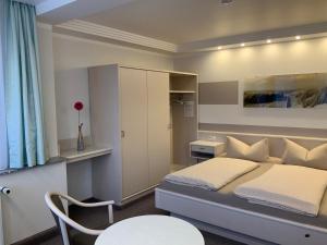 Postel nebo postele na pokoji v ubytování Pension Villa Transvaal
