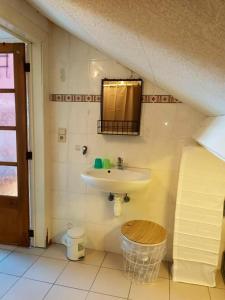 a bathroom with a sink and a toilet at Studio with city view at Saint Nicolas in Ans