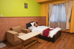Postel nebo postele na pokoji v ubytování Nepalaya Hotel