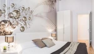 a bedroom with a bed and a wall with bubbles at San Polo Design Apartments by Wonderful Italy in Venice