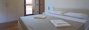 Postel nebo postele na pokoji v ubytování Adamo ed Eva Resort