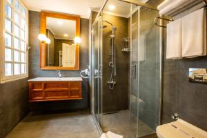 a bathroom with a shower and a sink at Zanike hotel in Trabzon