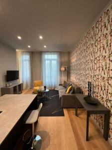 a living room with a couch and a table at GLI EQUILIBRISTI in Cuneo