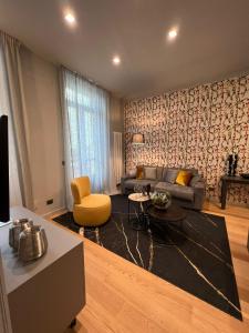 a living room with a couch and a table at GLI EQUILIBRISTI in Cuneo +8 photos