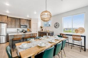 a kitchen and dining room with a table and chairs at Grandma Buddy's House in Garden City