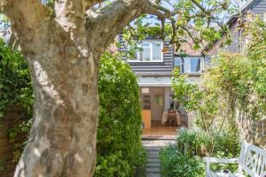 a view of a house with a tree at Peace Cottage in Whitstable