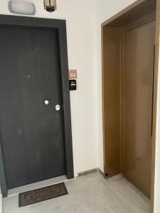 a pair of doors in a hallway at Design downtown suite (K2) in Larisa