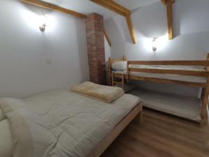 a bedroom with two bunk beds in a room at Vikendica Mihic in Zvornik