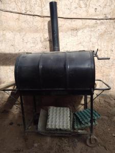 a metal stove with a pot on top of it at Lo del Gaucho in Tilcara