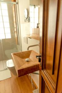 a bathroom with a wooden sink and a toilet at Chalet Bornhome CIR O17022 in Borno