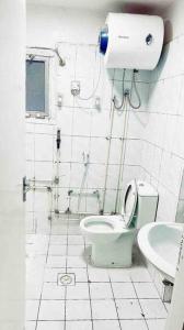 a bathroom with a toilet and a sink at 1 Room in apartment available for rent dating not allowd in Sharjah