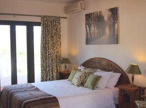 Postel nebo postele na pokoji v ubytování Hostal Avalon