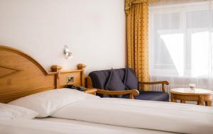 Postel nebo postele na pokoji v ubytování Walliserhof