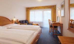 Postel nebo postele na pokoji v ubytování Walliserhof