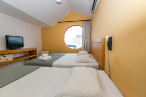 Postel nebo postele na pokoji v ubytování Safari Natal Beach Hotel + 37 fotografií
