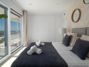 A bed or beds in a room at Magnificent penthouse with panoramics views Még 17 kép