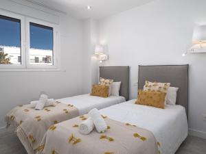 A bed or beds in a room at Magnificent penthouse with panoramics views