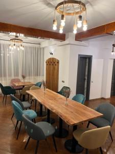 a dining room with wooden tables and chairs at Chesa Montana in Ranca