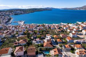 an aerial view of a town next to the water at Villa Moreta with heated pool, Sauna, Hot-tub in Trogir
