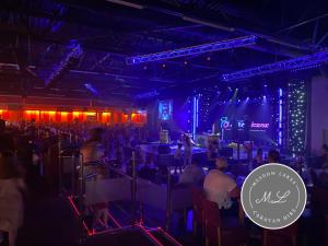 a crowd of people in a room with blue lights at Golden Palm Resort - Meadow Lakes 72 - ML72 in Chapel Saint Leonards