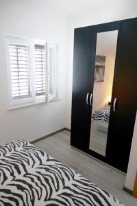Postel nebo postele na pokoji v ubytování Villa Martinovic 2